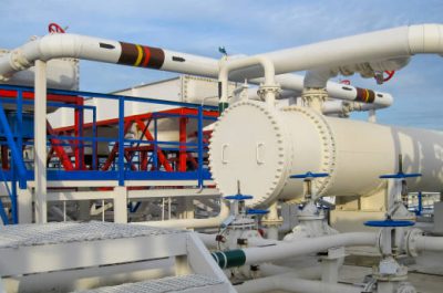 Heat exchangers in a refinery. The equipment for oil refining. Heated gasoline air cooler